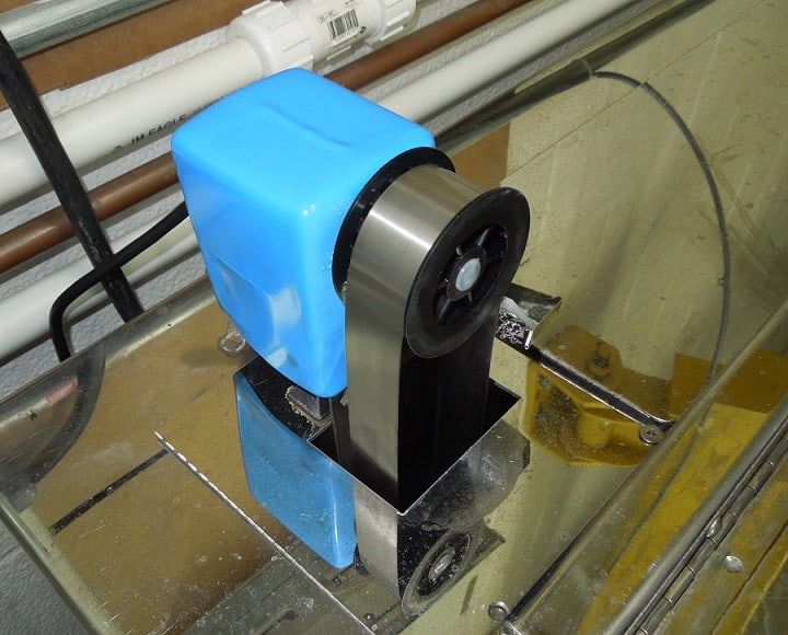 Mini-Skimmer stainless steel belt oil skimmer on a parts washer